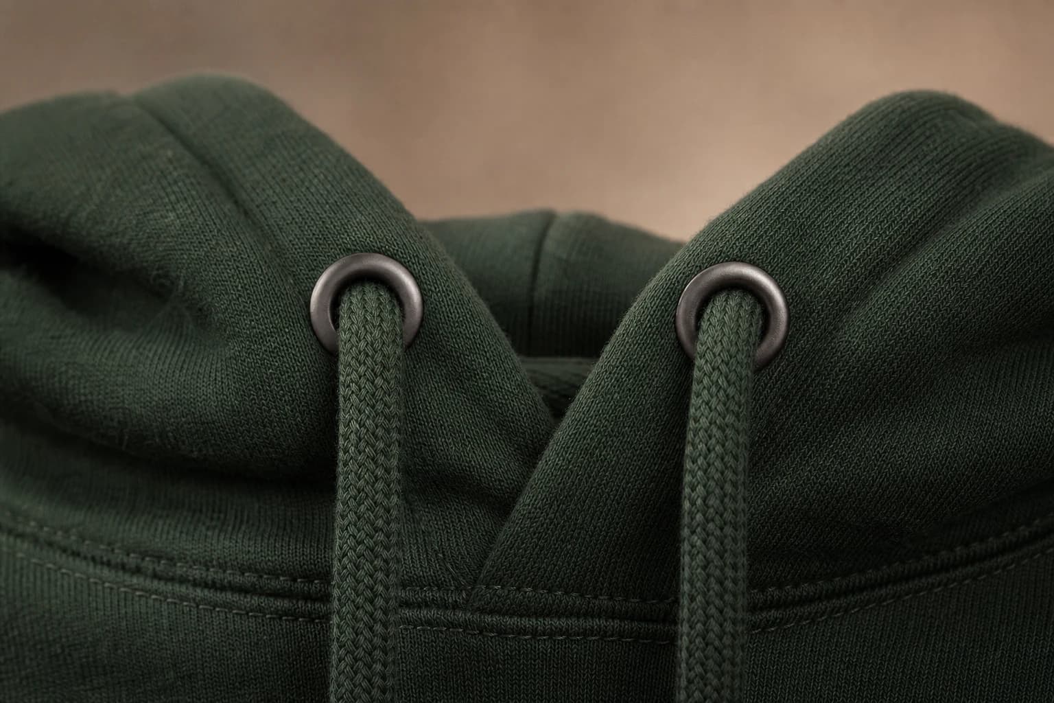 Pullover hoodie drawcord and reinforced metal eyelet construction