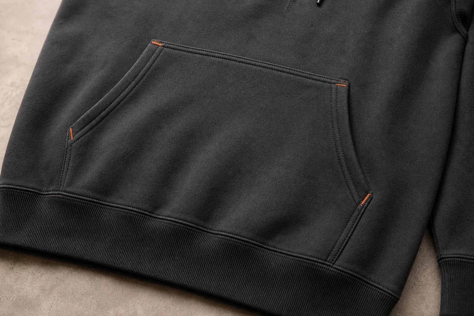Bar-tacked kangaroo pocket construction on a pullover hoodie