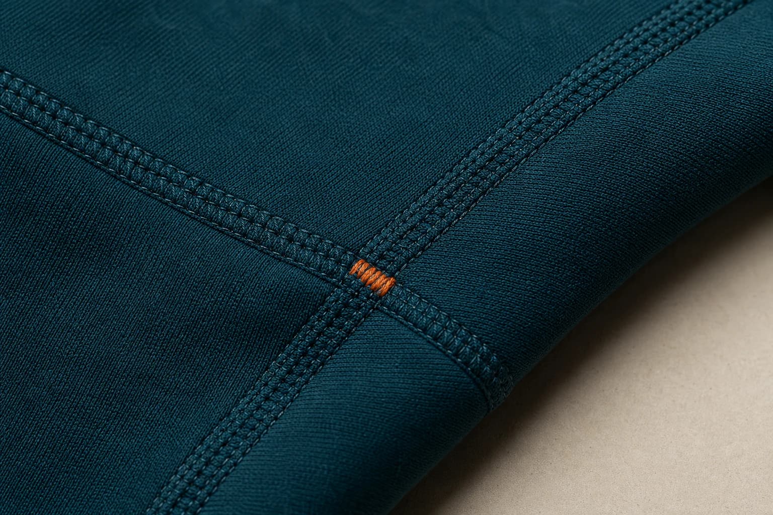 Reinforced flatlock seam and pullover hoodie fit construction