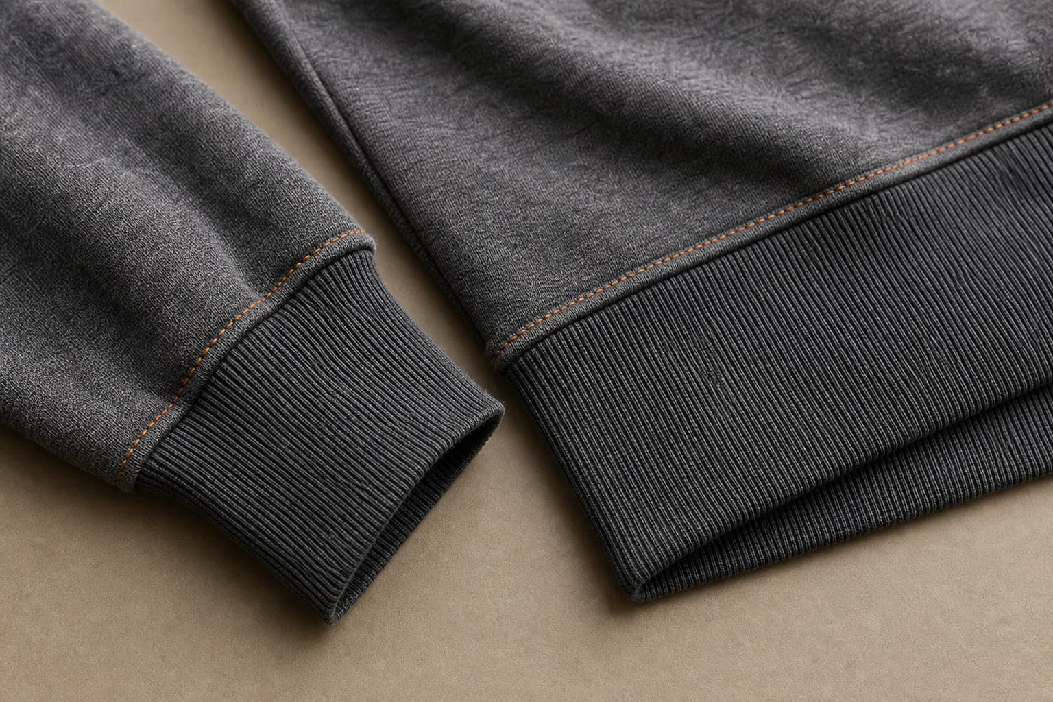 Rib-knit cuff and hem construction on a pullover hoodie