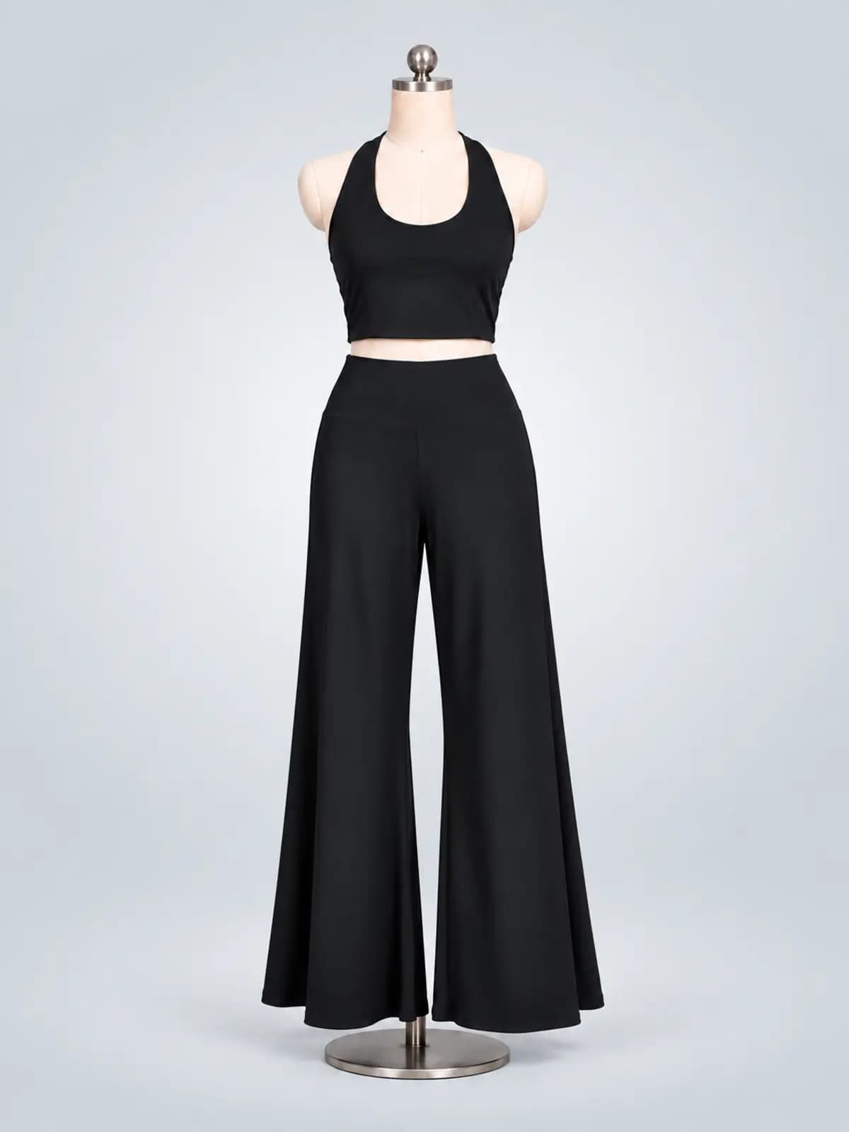 Black halter crop top and matching wide-leg pants displayed on a mannequin