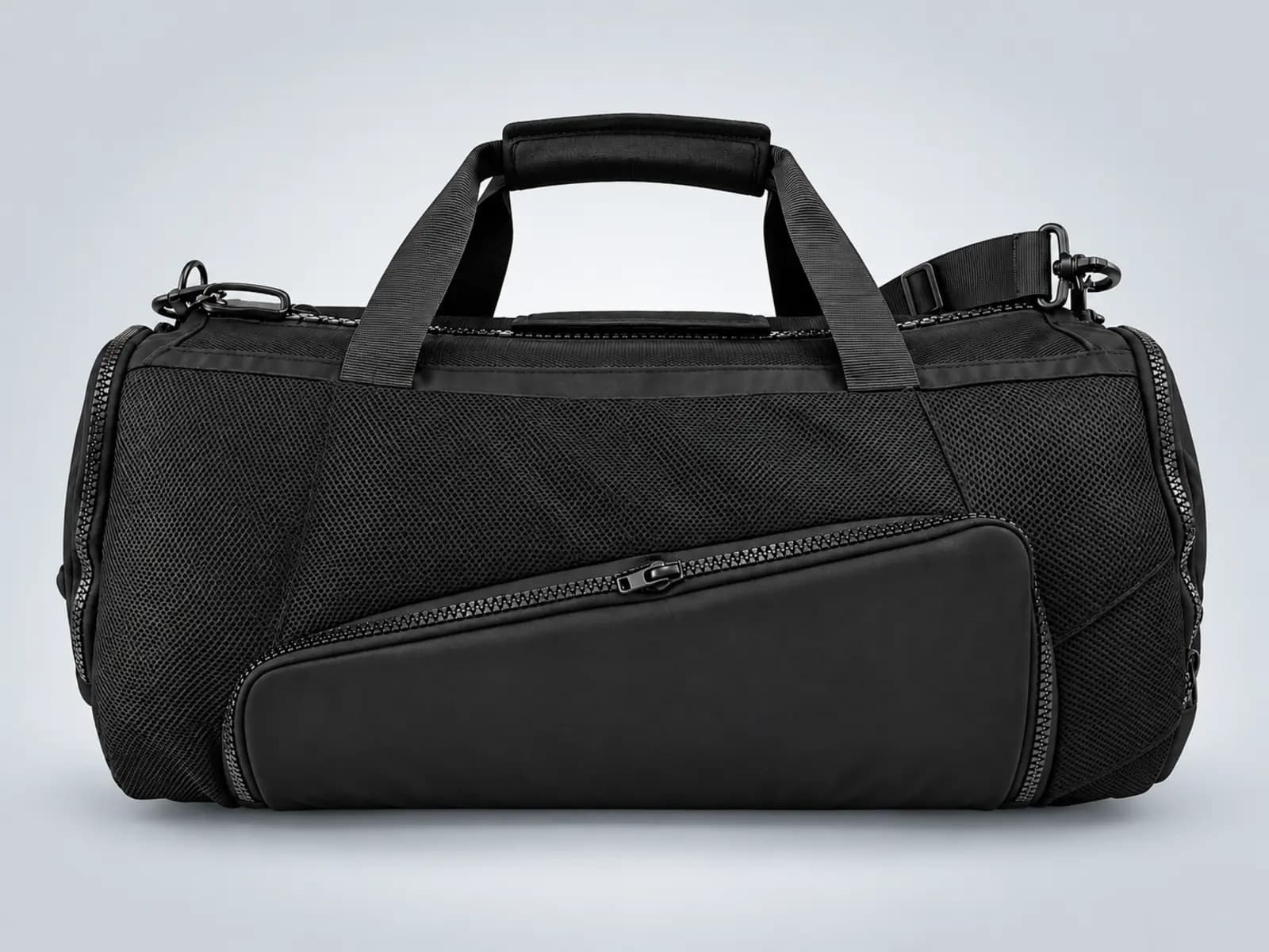 Black sports duffel bag with mesh panels, a front pocket and carry handles