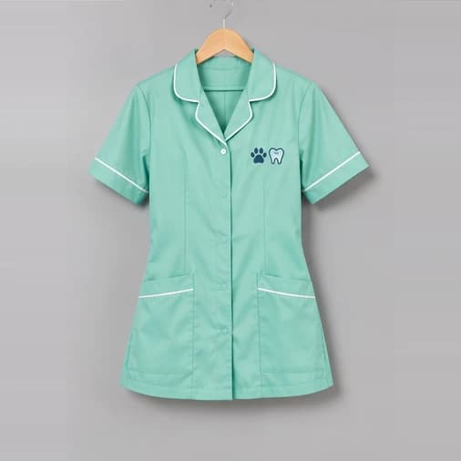 Mint dental and veterinary tunic with white piping and an embroidered emblem