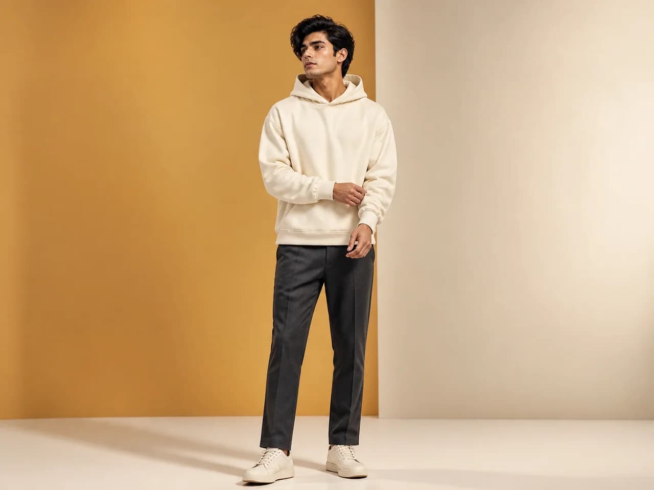 Male GenXport model wearing a plain oversized hoodie for Corporate & Promo Buyers