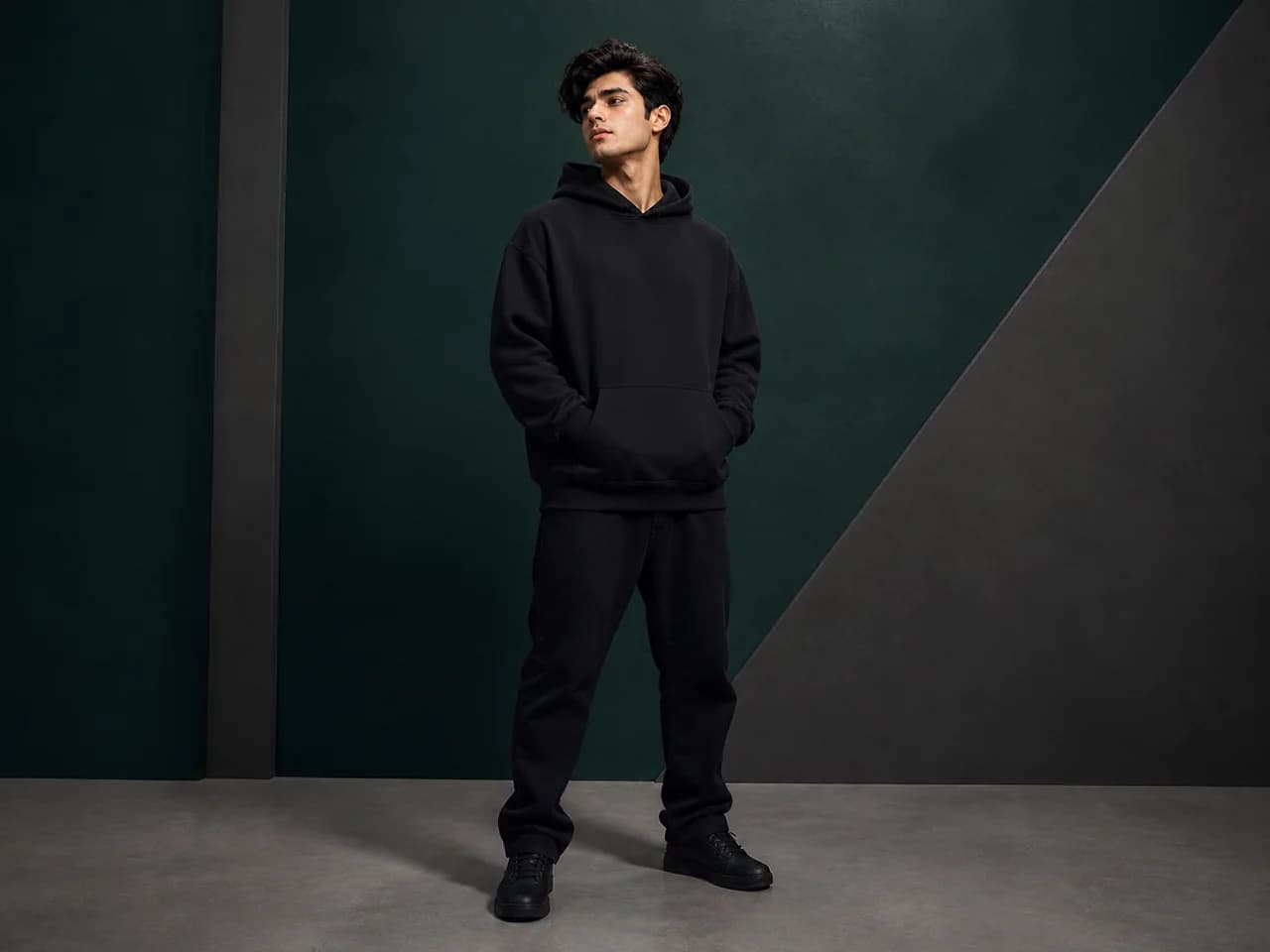 Male GenXport model wearing a plain oversized hoodie for Streetwear Brands